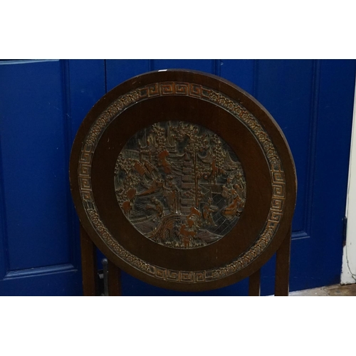 600 - A Chinese Carved Hardwood Flip-Top Tiffing Table decorated with a garden scene & a Greek Key Outer E... 