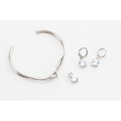 164 - A set of silver and paste earrings and pendant, along with a bangle.