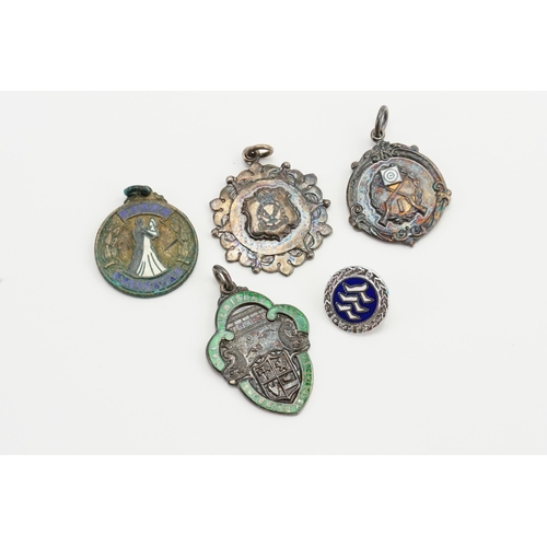 168 - Three silver and enamelled shooting and swimming medal pendants, along with one other and a small pi... 