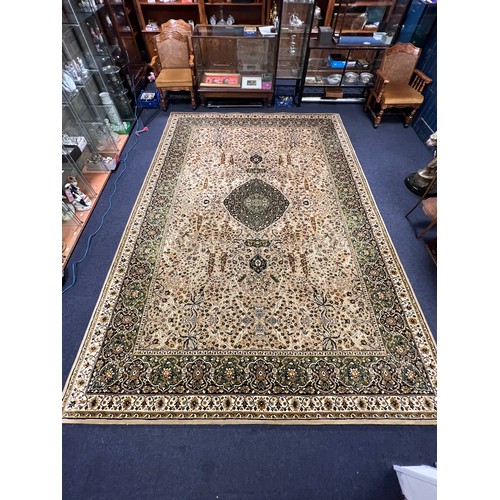 614 - A Beige, Brown & Black Floral edged Wilton Rug with decorative Gulls & Floral Pattern. Measuring: 13... 