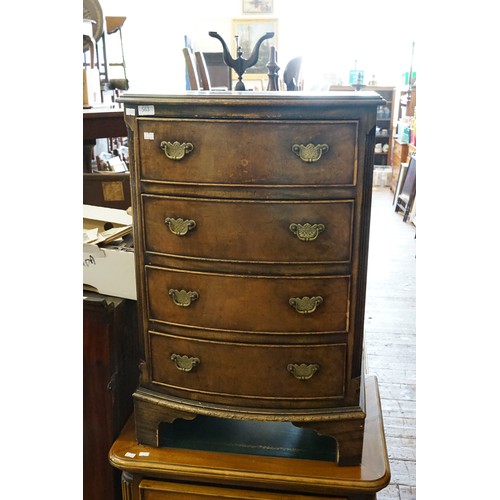 563 - A Bow Fronted Walnut designed Chest of Four Drawers. Measuring: 50cms across x 35cms deep x 76cms hi... 