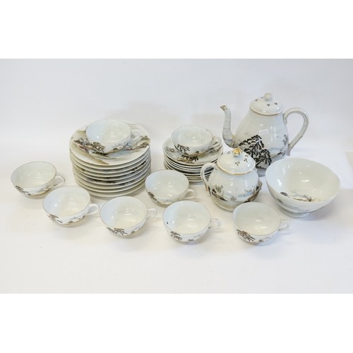 329 - A Japanese Egg Shell Tea Set decorated with Landscapes to include a Tea Pot, Saucers, Cups, etc. (AF... 