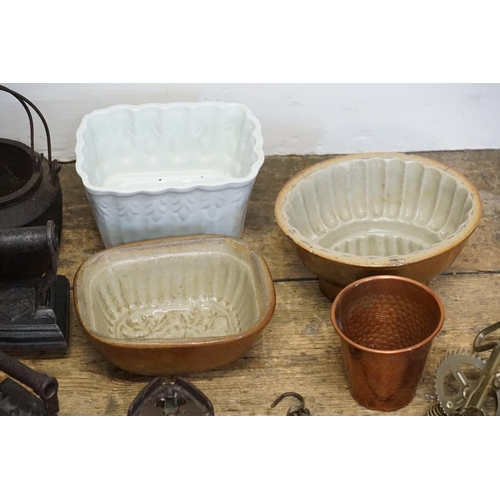 636 - A collection of jelly moulds, along with kitchen utensils etc.