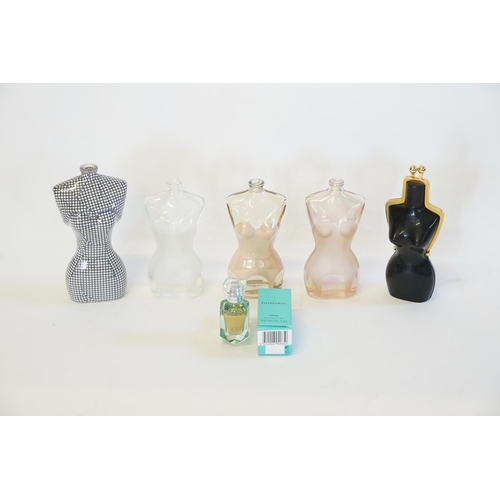 537 - A collection of pre production Jean Paul Gaultier bottles, along with a small Tiffany & Co perfume.