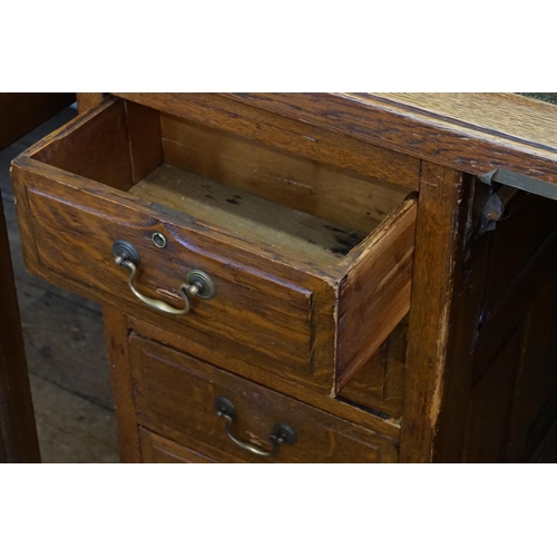 457 - A 1920s Panel Sided Oak Office Desk fitted with Drawers & a Gilt Leather Top. Measuring: 80cms deep ... 