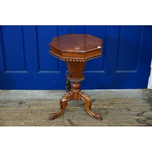 455 - A Victorian Lift-Up Top Needlework Table/Cabinet resting on Carved Paw Feet.