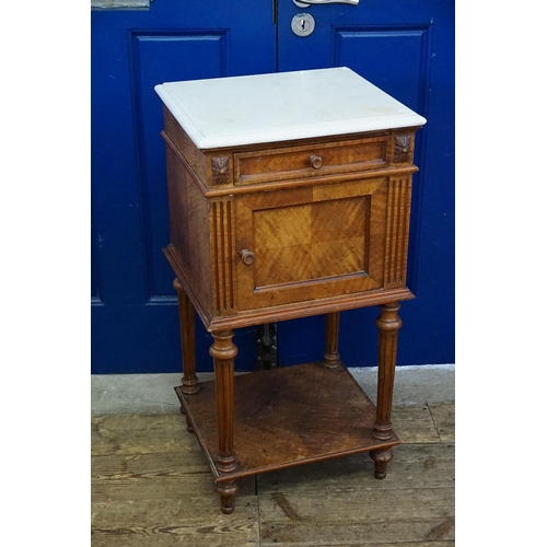 450 - A French Marble Topped Walnut Bedside Table resting on Turned Legs. Measuring: 43cms across x 39cms ... 