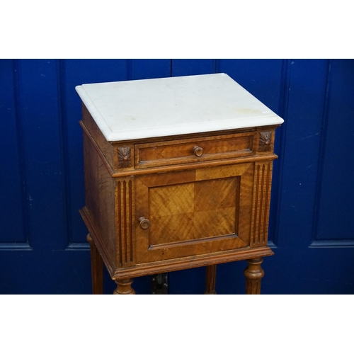 450 - A French Marble Topped Walnut Bedside Table resting on Turned Legs. Measuring: 43cms across x 39cms ... 