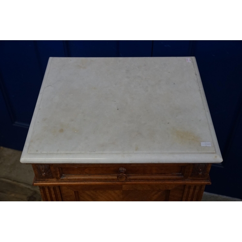 450 - A French Marble Topped Walnut Bedside Table resting on Turned Legs. Measuring: 43cms across x 39cms ... 