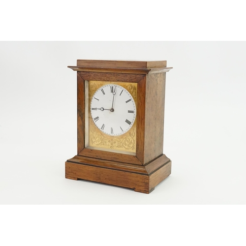 192 - A French Oak Cased Bracket Clock with a movement by 