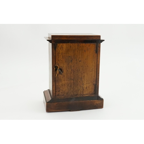 192 - A French Oak Cased Bracket Clock with a movement by 