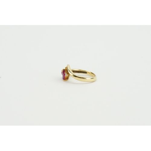 104 - A 18ct ruby and diamond set ring. Weight 3.5g. Size K.