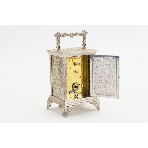 197 - A French Silver Plated & Dye Stamped Carriage Clock with Circular Chaptering with various flowers & ... 