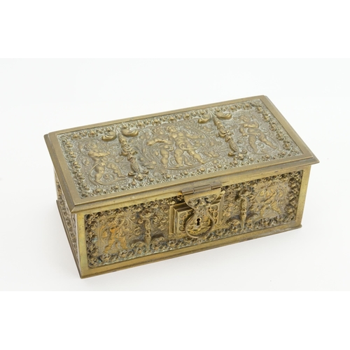 630 - A French Brass Comfrey Box designed with Cupids & Renaissance decoration. Measuring: 21cms x 10cms.