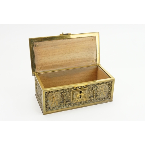 630 - A French Brass Comfrey Box designed with Cupids & Renaissance decoration. Measuring: 21cms x 10cms.