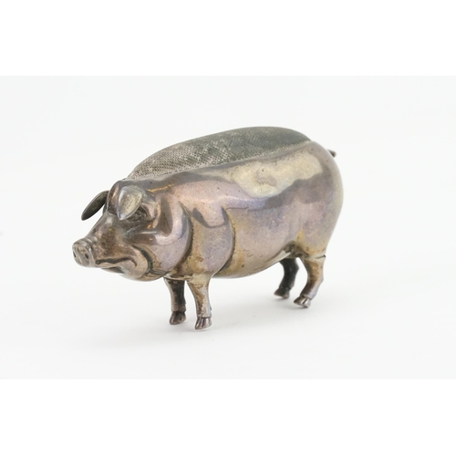 12 - An Edwardian Silver Pin Cushion designed as a Pig with a curly tail. Hallmarked.