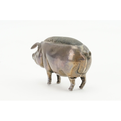 12 - An Edwardian Silver Pin Cushion designed as a Pig with a curly tail. Hallmarked.