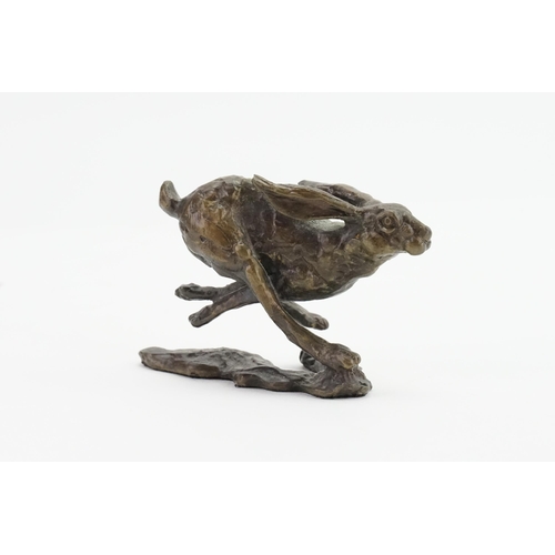 607 - A Limited Edition 202/250 Bronze of a Running Hare. Measuring: 7cms x 5cms.