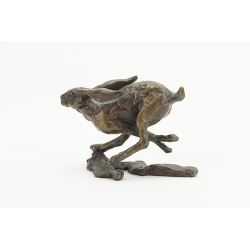 607 - A Limited Edition 202/250 Bronze of a Running Hare. Measuring: 7cms x 5cms.