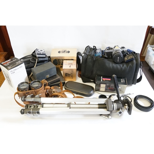 596 - A Collection of Cameras to include a Nikon Camera, Vivitar 70 x 210 Lens, Flash, Binoculars, Tripod,... 