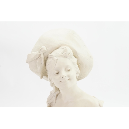 611 - An Art Nouveau Bronze Bust of a Young Girl by 