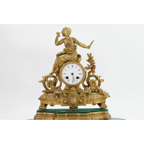 204 - A French Spelter Drawing Room Clock depicting a Young Maiden with garlands of flowers, Floral festoo... 