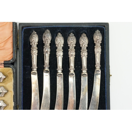 69 - A Silver Handled Set of 6 Butter Knives in Case along with one other..