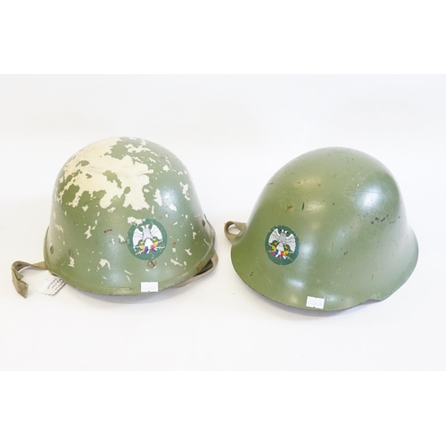 252 - A Serbian Balkan War Helmet with Transfer Decoration along with one other Kevlar Helmet.