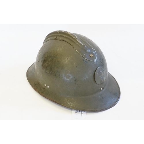 255 - A French Resistance Adrian Helmet with fluted top in green with fitted inside.