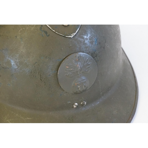 255 - A French Resistance Adrian Helmet with fluted top in green with fitted inside.