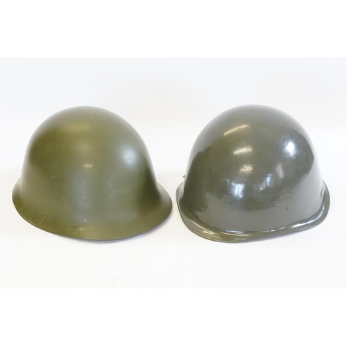 257 - A Hungarian Cold War Helmet along with one other in Green.