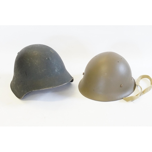 259 - A Reproduction Japanese Helmet & one other Helmet.