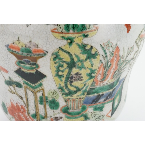 393 - A Japanese Crackle Glazed Green, Rust & Blue Garden Scene Jar & Cover. Measuring: 32cms High.