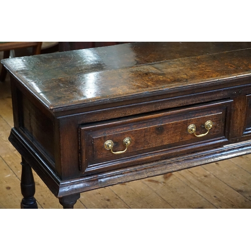 501 - An Antique Oak Dresser fitted with Three Drawers, Brass Swan Neck Handles, Two Plank Top, Turned Leg... 