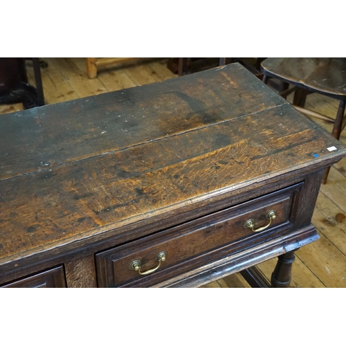 501 - An Antique Oak Dresser fitted with Three Drawers, Brass Swan Neck Handles, Two Plank Top, Turned Leg... 