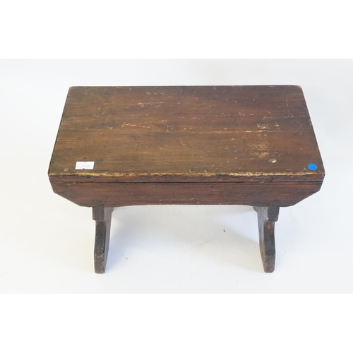 504 - A Boarded Milking Stool resting on shaped legs with a V Cut. Measuring: 33cms across x 17cms deep x ... 