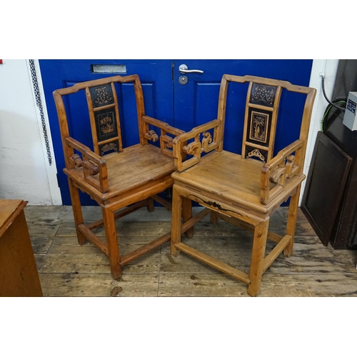 505 - A pair of Chinese open armed chairs, lacquered back decoration, resting on square legs.