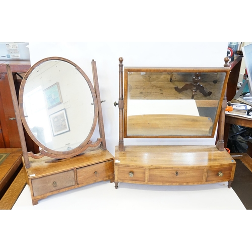 524 - A Georgian mahogany swing frame mirror, along with one other.