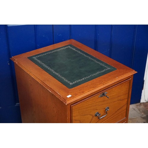 486 - A Reproduction Green Leather inlaid Filing Cabinet. Measuring: 50cms x 61cms x 78cms high.