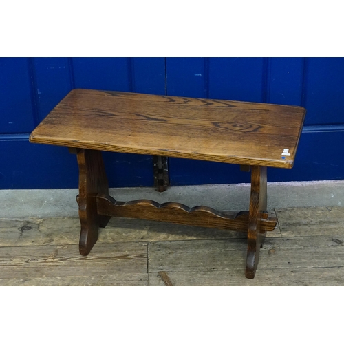 487 - A Reproduction Wooden Stool. Measuring: 76cms across x 36cms deep x 45cms high.