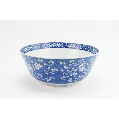 390 - A Chinese blue and white floral decorated large bowl, possibly marked with the four character mark o... 