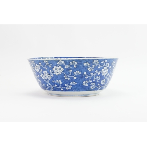 390 - A Chinese blue and white floral decorated large bowl, possibly marked with the four character mark o... 