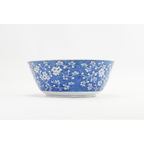 390 - A Chinese blue and white floral decorated large bowl, possibly marked with the four character mark o... 