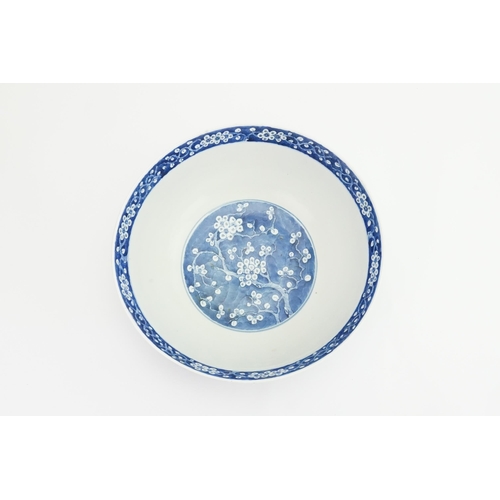 390 - A Chinese blue and white floral decorated large bowl, possibly marked with the four character mark o... 