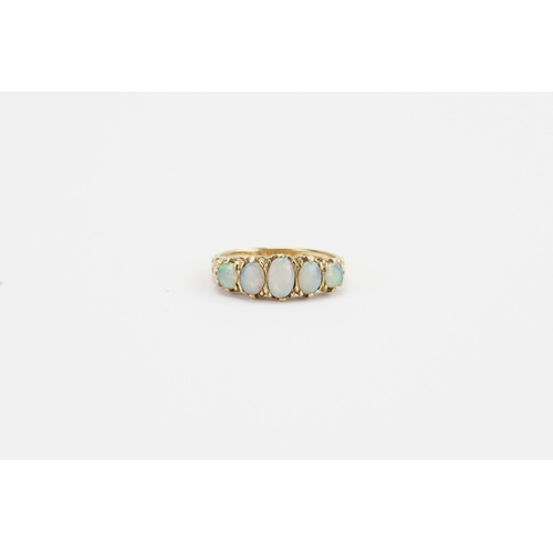 111 - A 9ct gold opal set ring, set with 5 opals. Size P. Weight 3.2g.