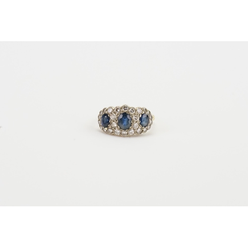 114 - A 18ct gold diamond and sapphire set ring. Set with three sapphires, the largest approximately 6mm x... 