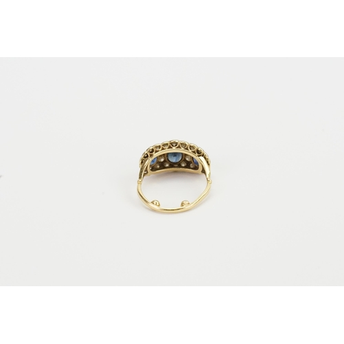 114 - A 18ct gold diamond and sapphire set ring. Set with three sapphires, the largest approximately 6mm x... 