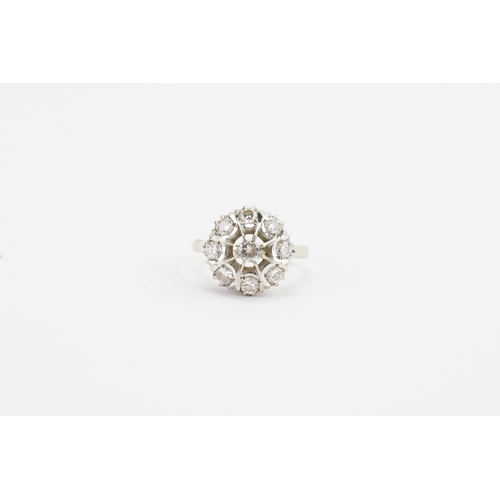 118 - An unmarked diamond cluster ring, set with 9 diamonds. Largest stone approximately 0.2ct. Weight 5.5... 