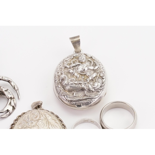 34 - A collection of silver mounted items, to include a silver crab, two silver engraved pendants.