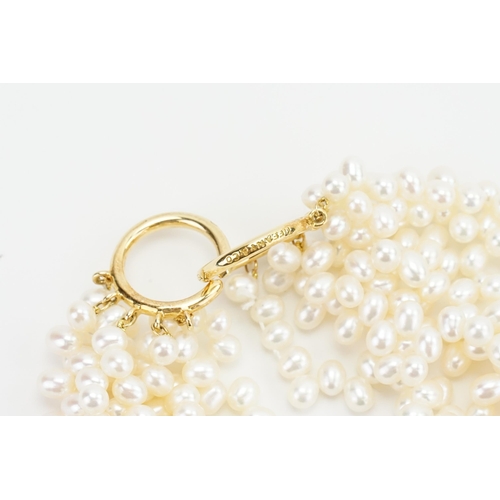 109 - A beautiful Tiffany & Co multi strand pearl necklace, with 18ct gold clasp. Designed by Paloma Picas... 